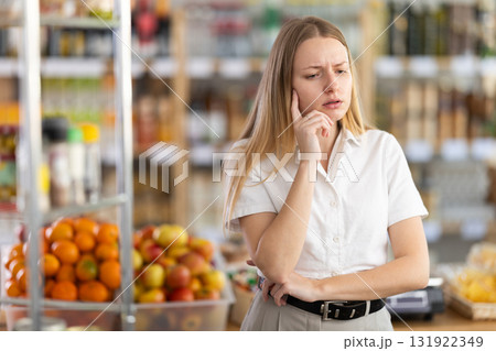 Young woman buyer forgot what she wanted to buy 131922349