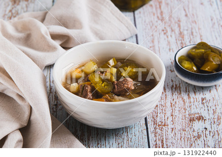 Delicious cabbage soup with beef and jalapenos in a bowl on the table 131922440