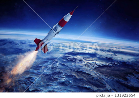 Aerial view of missile in flight over Earth's atmosphere showcasing dynamic propulsion and motion 131922654