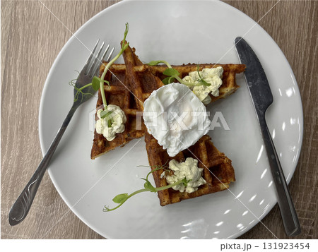 delicious and appetizing cheese waffles on a plate with auce delicious and appetizing cheese waffles on a plate with auce 131923454