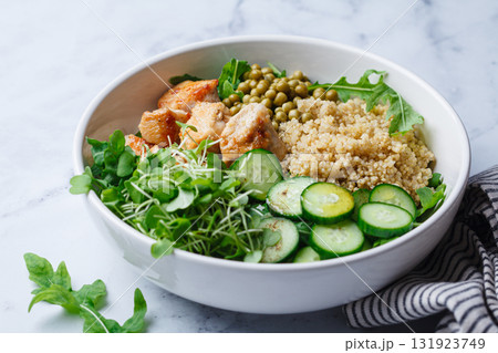 Balanced quinoa, arugula, chicken, cucumber and pea lunch bowl. Balanced quinoa, arugula, chicken, cucumber and pea lunch bowl. 131923749