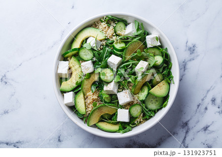 Green quinoa salad with cucumber, avocado and feta. Green quinoa salad with cucumber, avocado and feta. 131923751