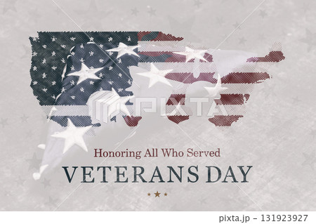 Patriotic Veterans Day greeting with the text Happy Veterans Day Honoring All Who Served over the folded United States flag on a wooden surface. Concept of American patriotism. 131923927