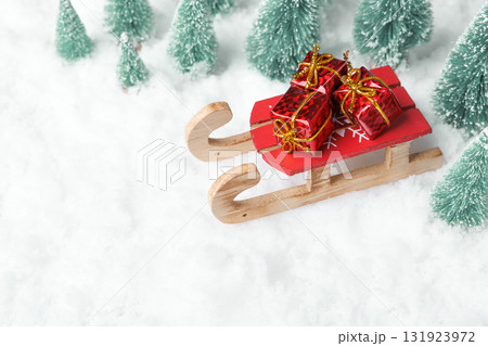 Wooden sleds in the snow with gifts Wooden sleds in the snow with gifts 131923972