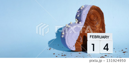 Calendar date 14 February greeting card Delicious fresh croissant topped with colorful flavor Ganache. Creation unique heart shape bakery. Puff pastry holiday love gift present idea Valentine's day 131924950