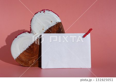 Empty template paper note mockup Heart shaped white chocolate croissant on pink background with copy space. Puff pastry new trendy sweet dessert bakery. Creamy dough 131925051