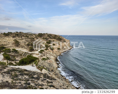 A Serene and Beautiful Coastal Landscape Featuring Gentle Waves and Sandy Shores 131926299