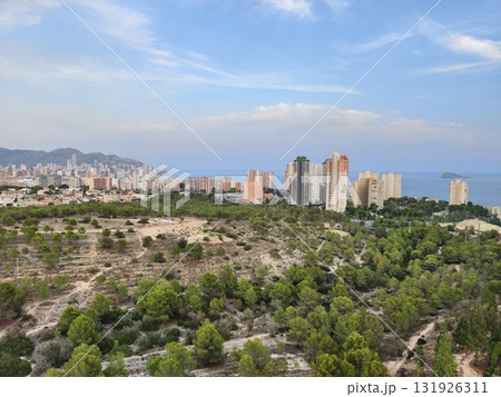 Experience the Stunning Aerial View of Benidorms Beautiful Green Hills and Iconic Coastal Skyline 131926311