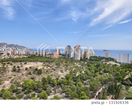 Enjoy the stunning coastal view of a vibrant city beautifully surrounded by rich nature Enjoy the stunning coastal view of a vibrant city beautifully surrounded by rich nature 131926336