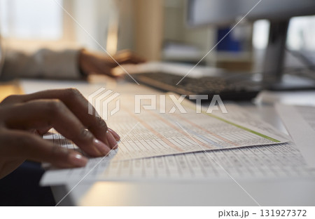 Woman accountant working in the office, doing business paperwork and using a computer 131927372
