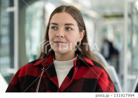 Girl sit in tram car, getting to work Girl sit in tram car, getting to work 131927994