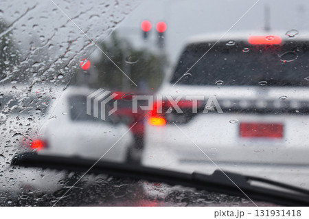 car on highway road with rainny season, blurred image 131931418