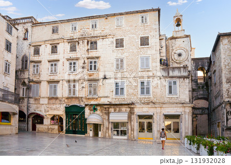 Woman walking through old city square in Split, Croatia 131932028