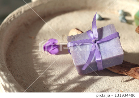 Cubes of natural soap against backdrop of natural elements. Handicrafts and hobbies. Cosmetics and beauty. Eco-friendly products. Background, composition for design. 131934480