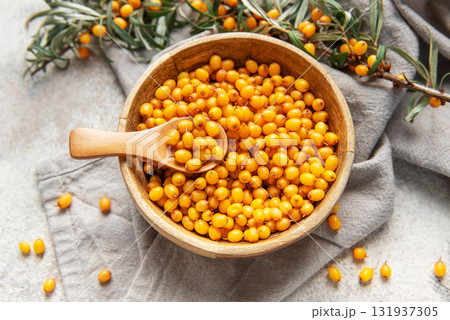 Sea buckthorn berries in wooden bowl 131937305