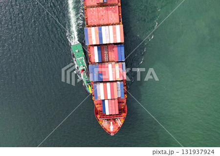Aerial view of container transportation business, import-export, logistics, transportation by large cargo ships international trade concept. Aerial view of container transportation business, import-export, logistics, transportation by large cargo ships international trade concept. 131937924