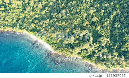 Koh Kood in Thailand. Aerial view of wave waters, white sandy beaches and rich forest nature 131937925