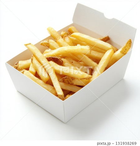 Crispy golden french fries served in a white container ready for enjoyment at a casual dining setting 131938269