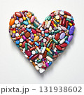 Heart shape made from colorful pills and capsules on a white background represents health and wellness concepts 131938602