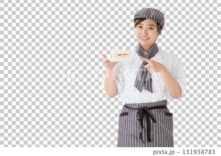 一位身穿廚師服的女士手裡拿著一塊脆餅 一位身穿廚師服的女士手裡拿著一塊脆餅 131938783