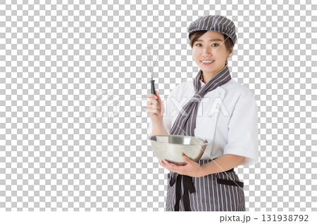 ボールでホイップを混ぜるコックコートを着た女性 131938792