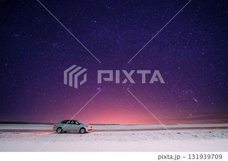 Car Sedan In Country Road At Winter Evening Car Sedan In Country Road At Winter Evening 131939709