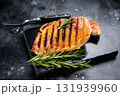 Grilled chicken breasts steaks with rosemary, farm poultry meat, top view, black background. 131939960