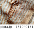 Torn fabric. Frayed cloth background for sample, presentation, safety issue, excessive acid wash warning etc 131940131