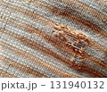 Torn fabric. Frayed cloth background for sample, presentation, safety issue, excessive acid wash warning etc 131940132