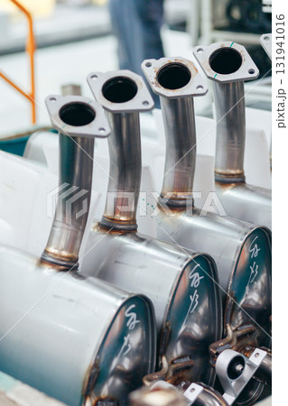 Galvanized steel car muffler with exhaust pipes in batch for assembling on automotive industry. Galvanized steel car muffler with exhaust pipes in batch for assembling on automotive industry. 131941016