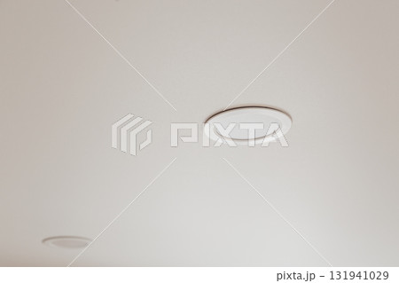 White stretch ceiling with spot lights in room White stretch ceiling with spot lights in room 131941029