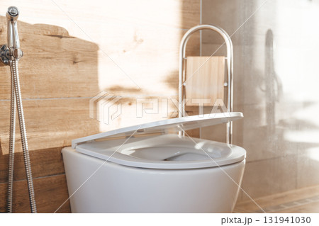 Hanging toilet with soft closing toilet seat lid hinge. Hanging toilet with soft closing toilet seat lid hinge. 131941030