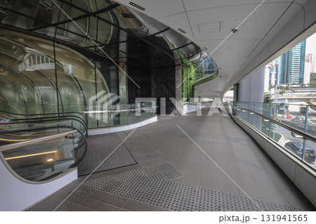 Oct 4 2025 Glass Atrium Walkway With Curved Architecture And Urban Exterior Oct 4 2025 Glass Atrium Walkway With Curved Architecture And Urban Exterior 131941565