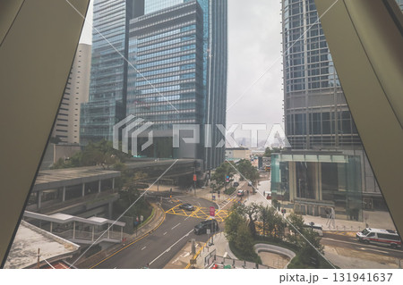 Oct 4 2025 Inside A Modern Glass Atrium Looking Out Over A Dense City Skyline 131941637