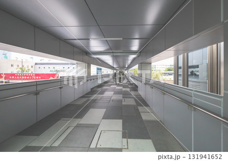 Oct 4 2025 Long Indoor Skybridge Corridor With Walking People 131941652