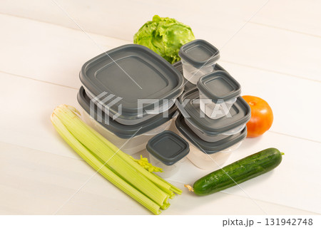 Plastic containers with green salad Plastic containers with green salad 131942748
