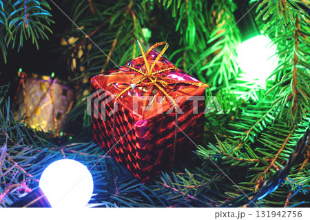 Red gifts under the Christmas tree 131942756