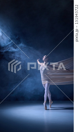Graceful ballerina in ethereal light with flowing fabric motion 131943722