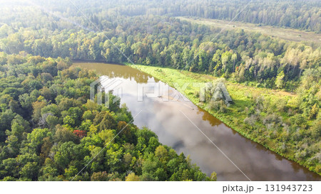 A river with a forest on either side 131943723