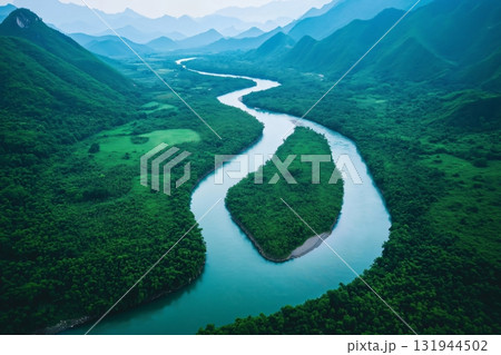 Aerial view of a beautiful turquoise river winding through a green valley, surrounded by mountains and forest Aerial view of a beautiful turquoise river winding through a green valley, surrounded by mountains and forest 131944502