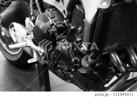 A detailed black-and-white shot focusing on the motorcycle engine 131945011