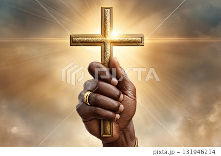 Hand holding golden cross against shining light Hand holding golden cross against shining light 131946214