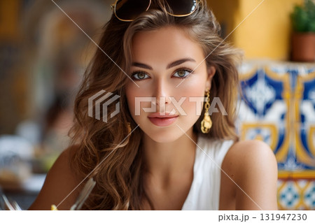 Woman with sunglasses posing in a beautiful restaurant 131947230