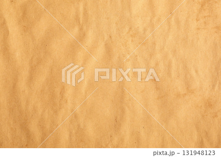 Crumpled craft brown paper with slight visible stains Crumpled craft brown paper with slight visible stains 131948123