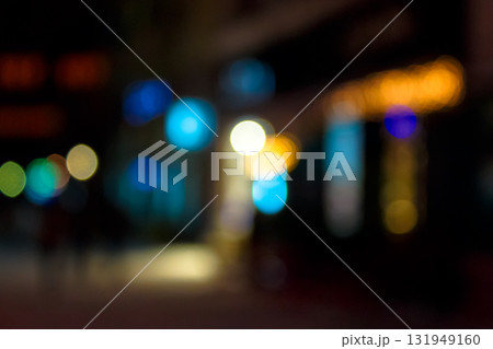 abstract christmas background. blurred city street lights at night. defocused photo. winter holiday concept. festive urban scene backdrop of uzhhorod with bokeh effect. bright and colorful circular abstract christmas background. blurred city street lights at night. defocused photo. winter holiday concept. festive urban scene backdrop of uzhhorod with bokeh effect. bright and colorful circular 131949160