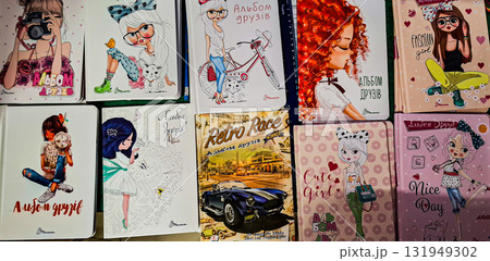 Collection of notebooks with fashion illustrations for children. The covers feature cartoon-style illustrations depicting girls in different styles. Collection of notebooks with fashion illustrations for children. The covers feature cartoon-style illustrations depicting girls in different styles. 131949302