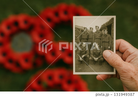 Armistice Remembrance Day concept with vintage soldier photo and poppies Armistice Remembrance Day concept with vintage soldier photo and poppies 131949387