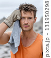 Construction Worker Wearing Mask and Yellow Jacket Outdoors 131950298
