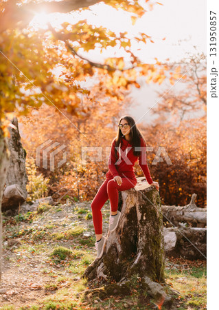 beautiful woman relax in autumn forest 131950857
