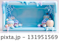 ハロウィンの可愛いカップケーキやカボチャで飾られた水色のメルヘンなフレーム背景。 131951569